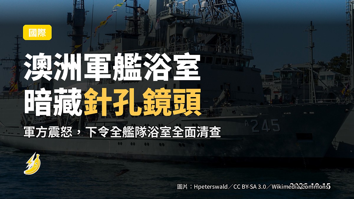  naval ship moored at a port, no people visible